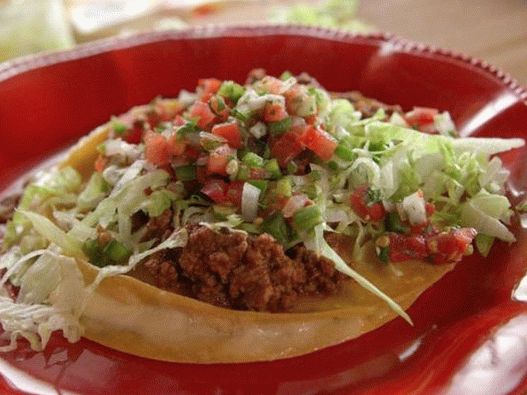 Photo of cheese quesadilla with meat sauce and fresh salsa
