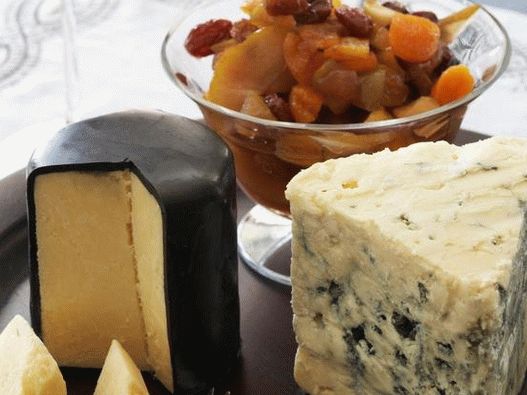 Photo Cheese plate with winter dried fruit compote
