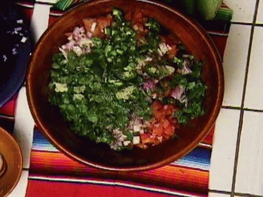 Photo of salsa sauce with tomatoes and jalapenos