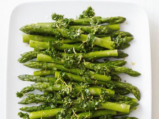 Photo Asparagus with parsley on a side dish