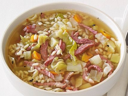Photo Soup of pearl barley, cabbage with beef jerky