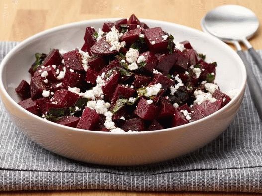 Photo of Beets in a microwave with tops and goat cheese
