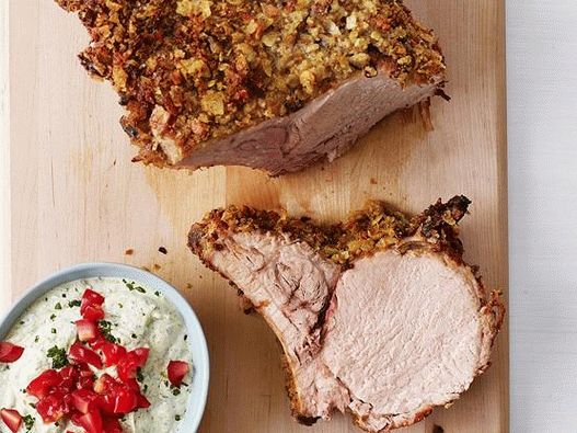 Photo Pork loin on the bone with potato crust and pesto