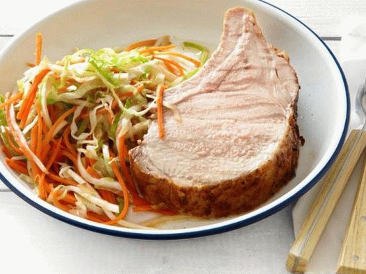 Photo of grilled pork loin on the ribs, with marinated religion