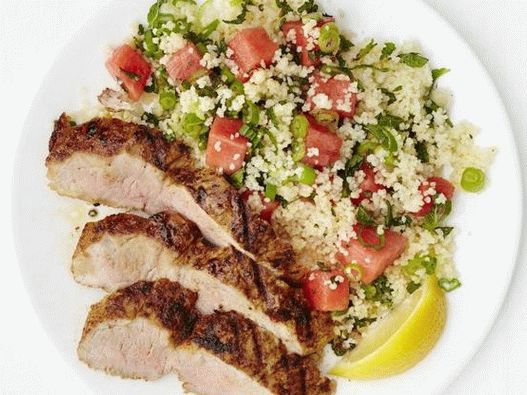 Photo grilled pork tenderloin with watermelon and tabula