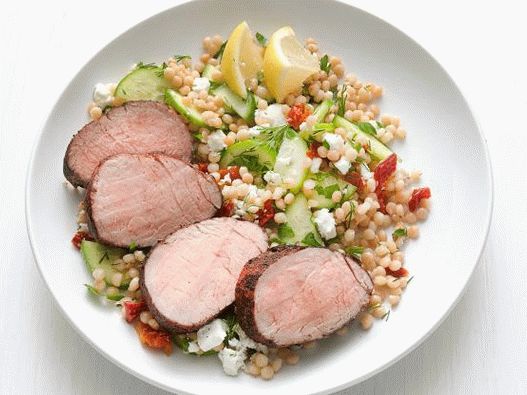 Photo Pork tenderloin in a pan