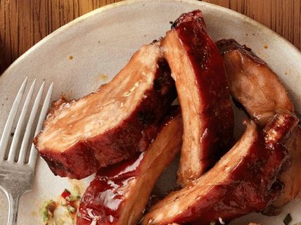 Photo Pork ribs baked in a sweet-spicy sauce