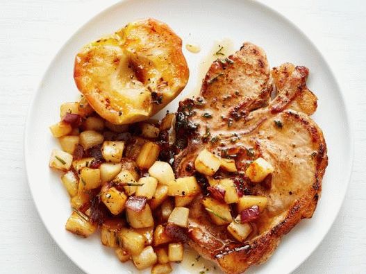 Photo Pork steak on the bone with baked apples