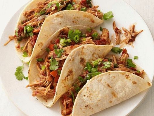 Photo of a Tacos with a turkey in a mole sauce in a slow cooker