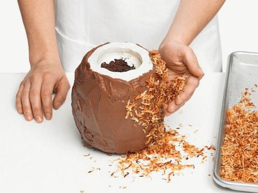 Press a handful of fried coconut flakes to the icing