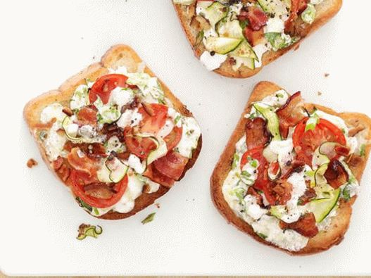 Photo Toasted with zucchini and bacon, baked with cheese