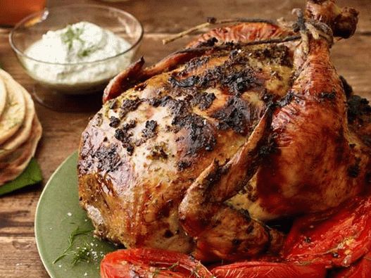 Chicken with greens and tomatoes in the oven