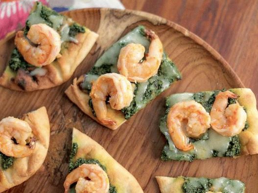 Pizza with kale cabbage pesto sauce and scampi shrimps