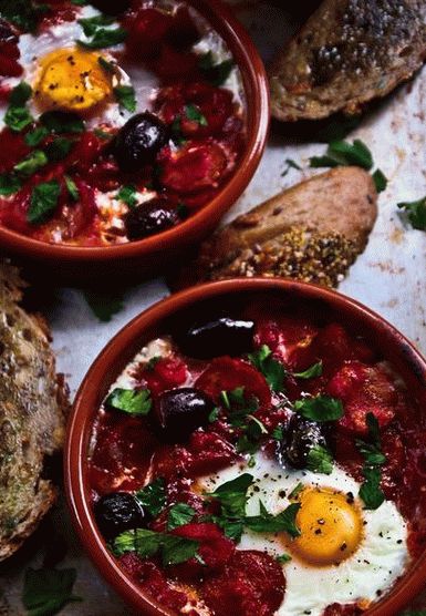 Photo of baked fried eggs with tomatoes