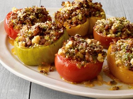 Photo Baked tomatoes stuffed with sausage, celery and basil