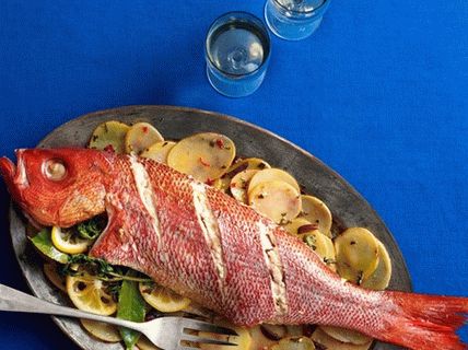 Photo of an oven-baked red snapper with potatoes