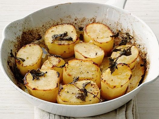 Photo Baked potato wedges with oregano