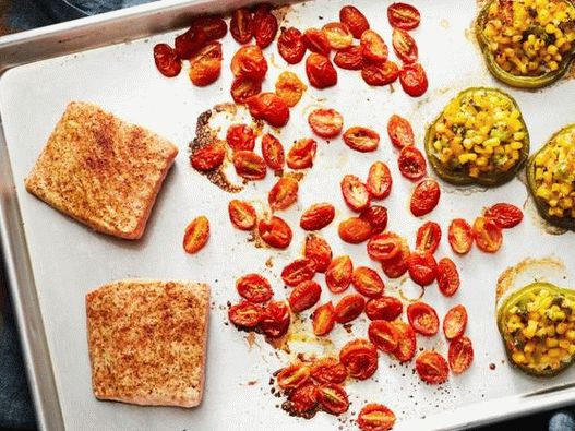 A healthy dinner on a baking tray with salmon