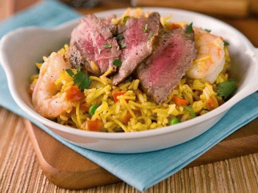 Paella with meat and shrimp