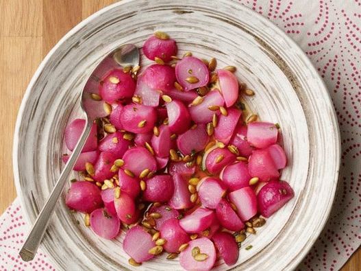 Radish in butter with honey and chives in the microwave