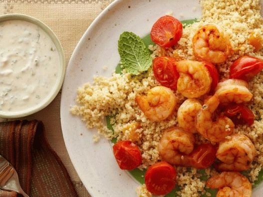 Shrimp with couscous and yogurt and hummus sauce