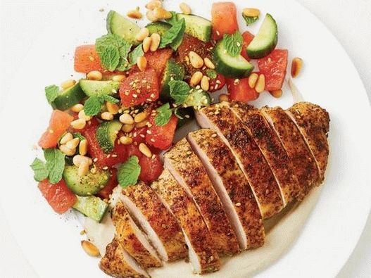Photo of fried chicken seasoned with zaatar with watermelon salad