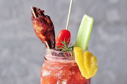 Photo of fried chicken wings in sauce